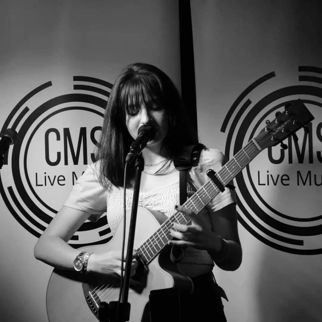 Abby Camsell performing live music
