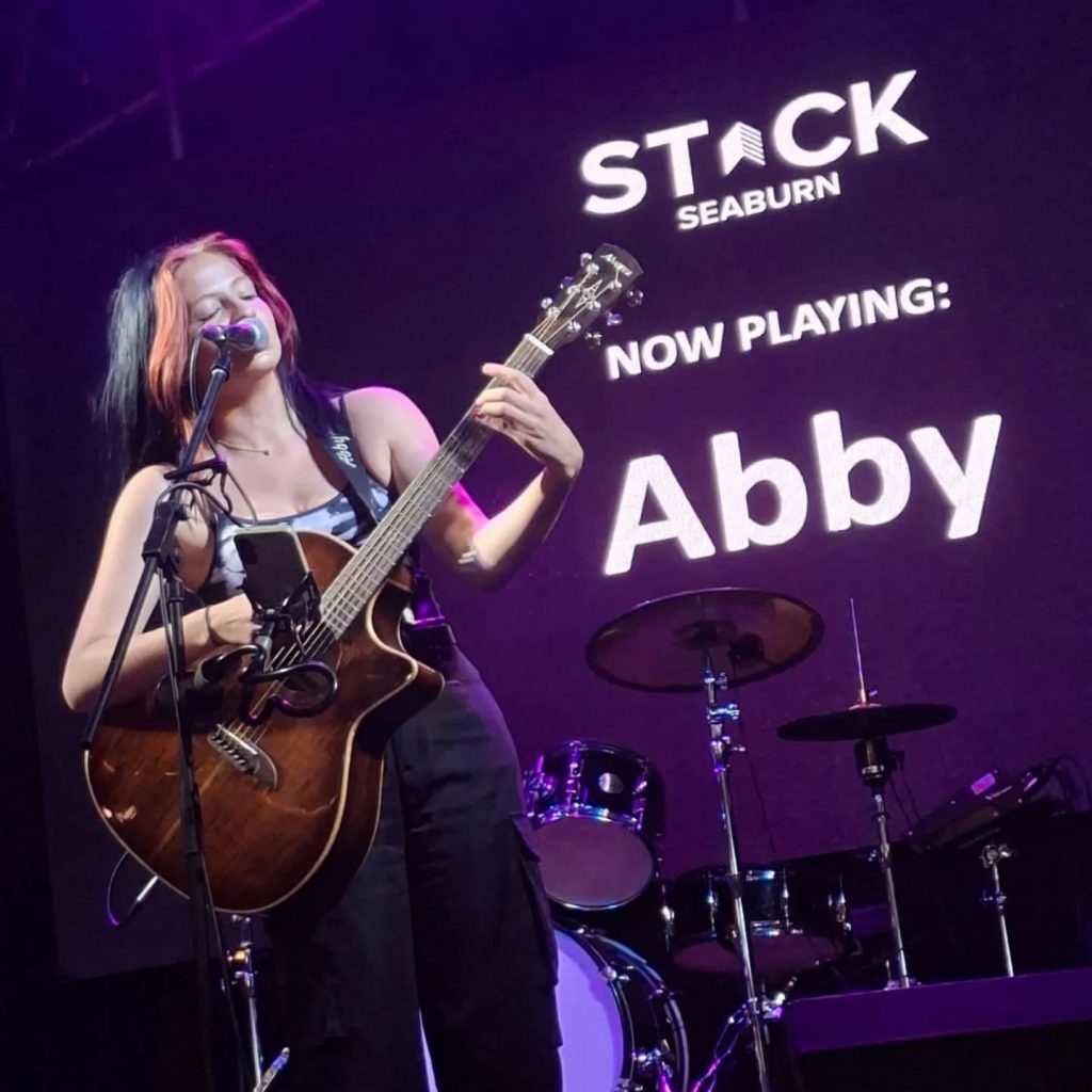Abby Camsell performing live music
